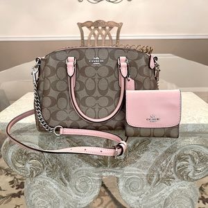 Coach signature handbag and wallet set.